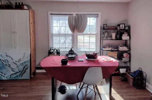 a view of a dining room with furniture and window