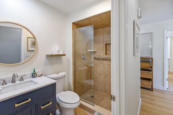 a bathroom with a double vanity sink and a mirror