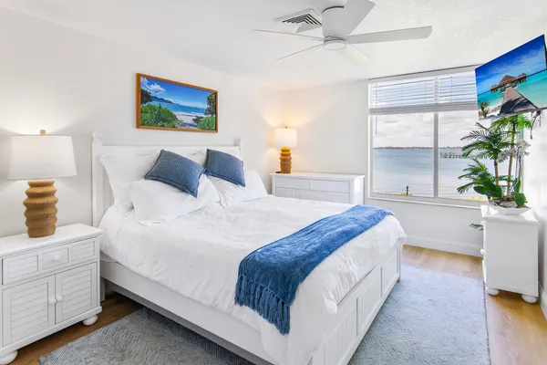 a large white bed in a white room