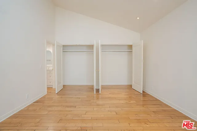 a bathroom with a tub sink shower and mirror