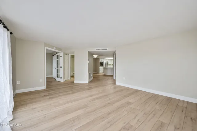 a view of a kitchen with wooden floor