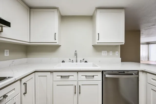 a stove top oven sitting inside of a kitchen