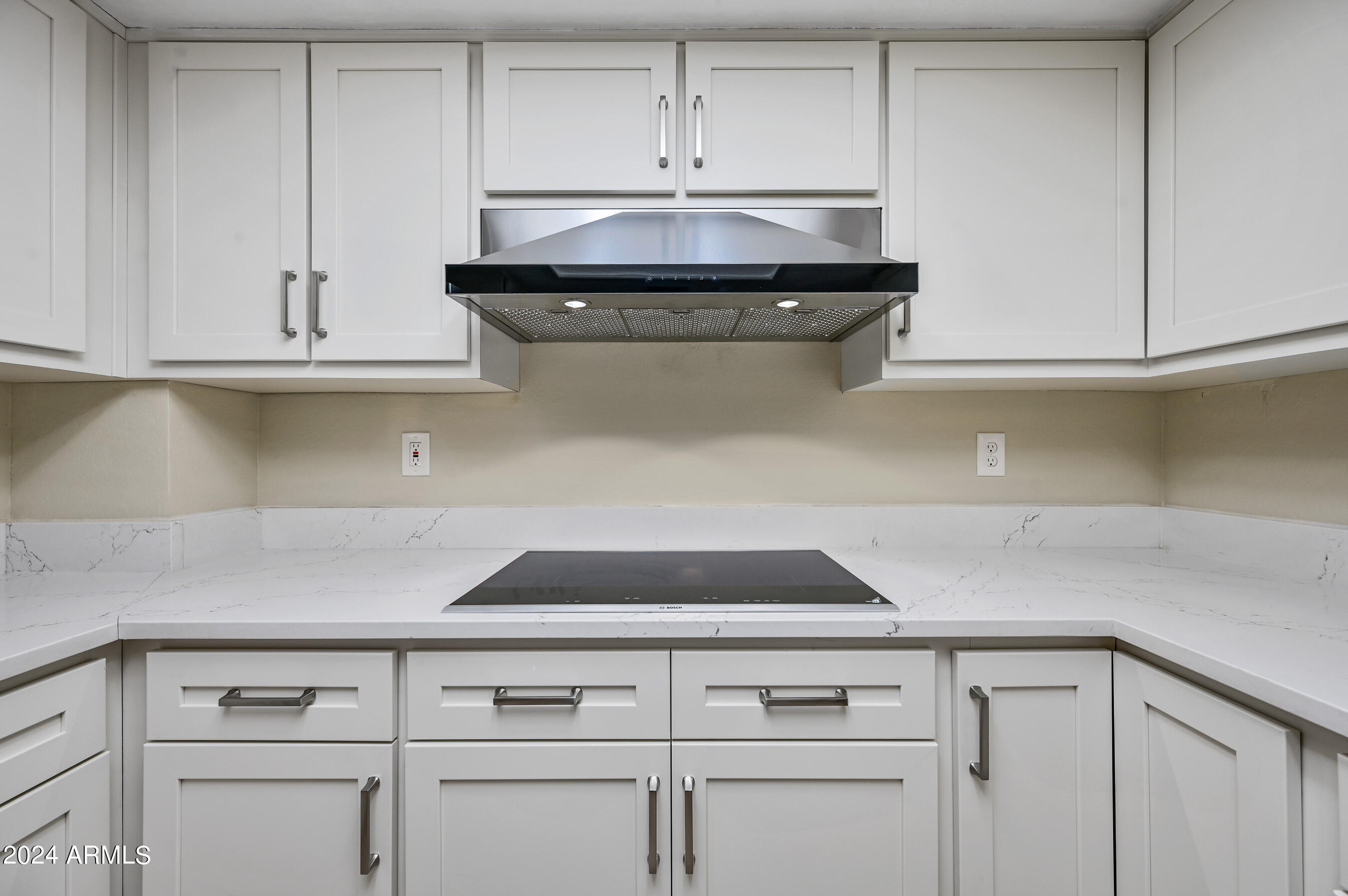 17404 North 99th Avenue, Unit 338 Sun City, AZ 85373 - Photo 16 of 27 a stove top oven sitting inside of a kitchen