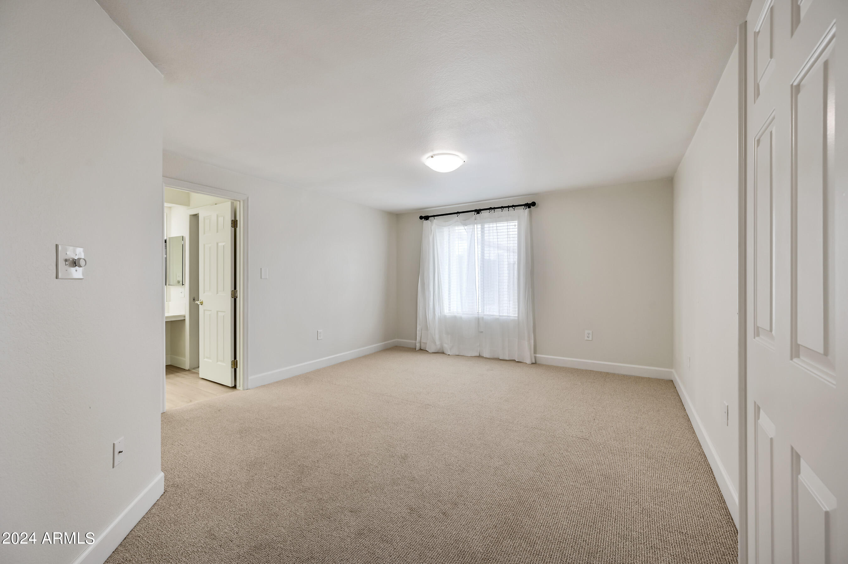 17404 North 99th Avenue, Unit 338 Sun City, AZ 85373 - Photo 19 of 27 an empty room with windows and closet