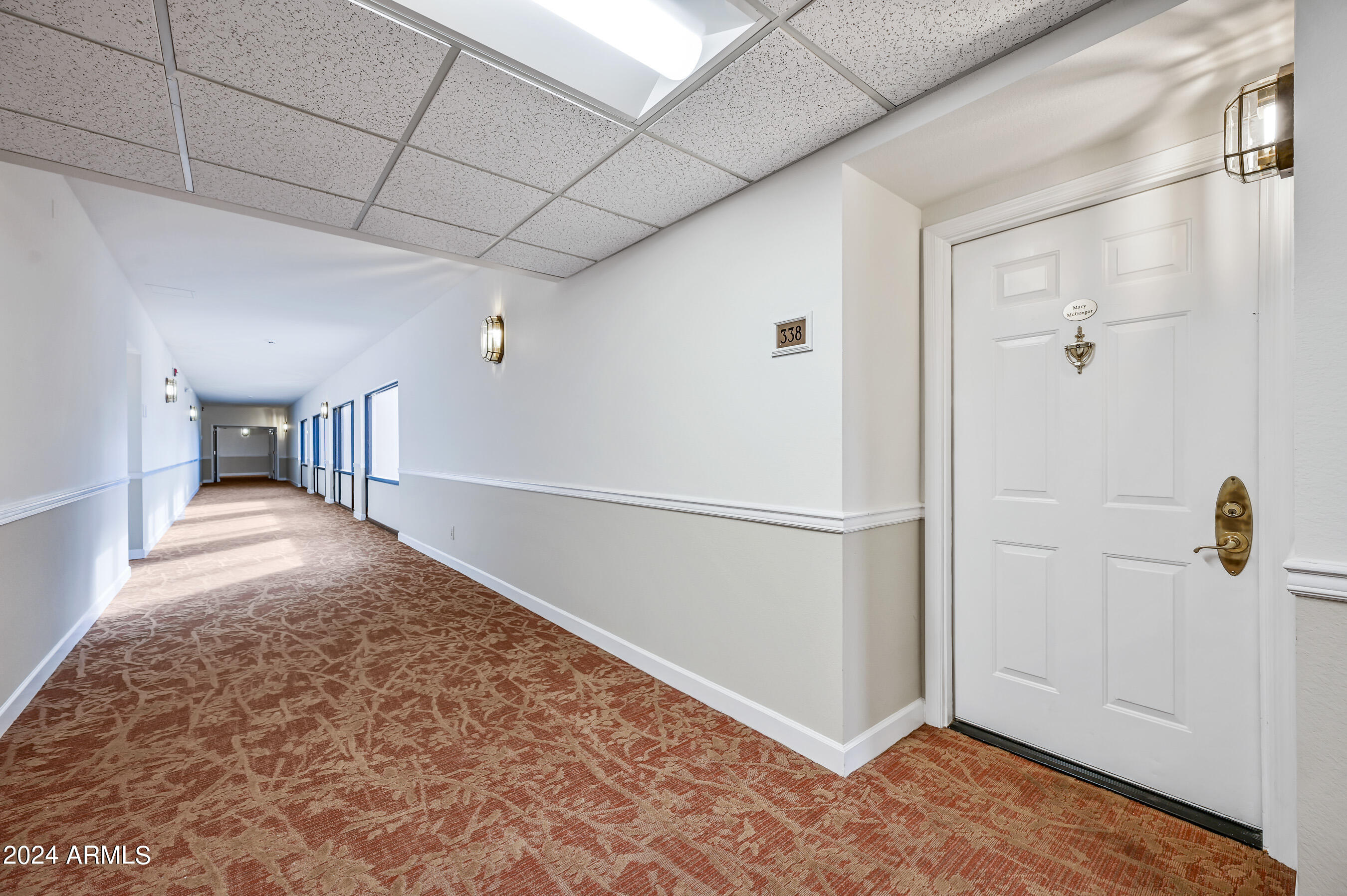 17404 North 99th Avenue, Unit 338 Sun City, AZ 85373 - Photo 2 of 27 a view of a hallway to closet area