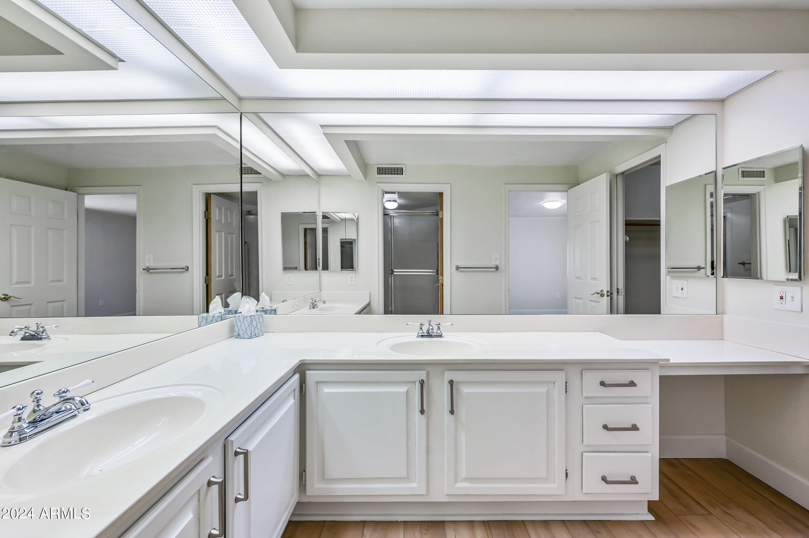 17404 North 99th Avenue, Unit 338 Sun City, AZ 85373 - Photo 23 of 27 a bathroom with a sink double vanity granite and a vanity