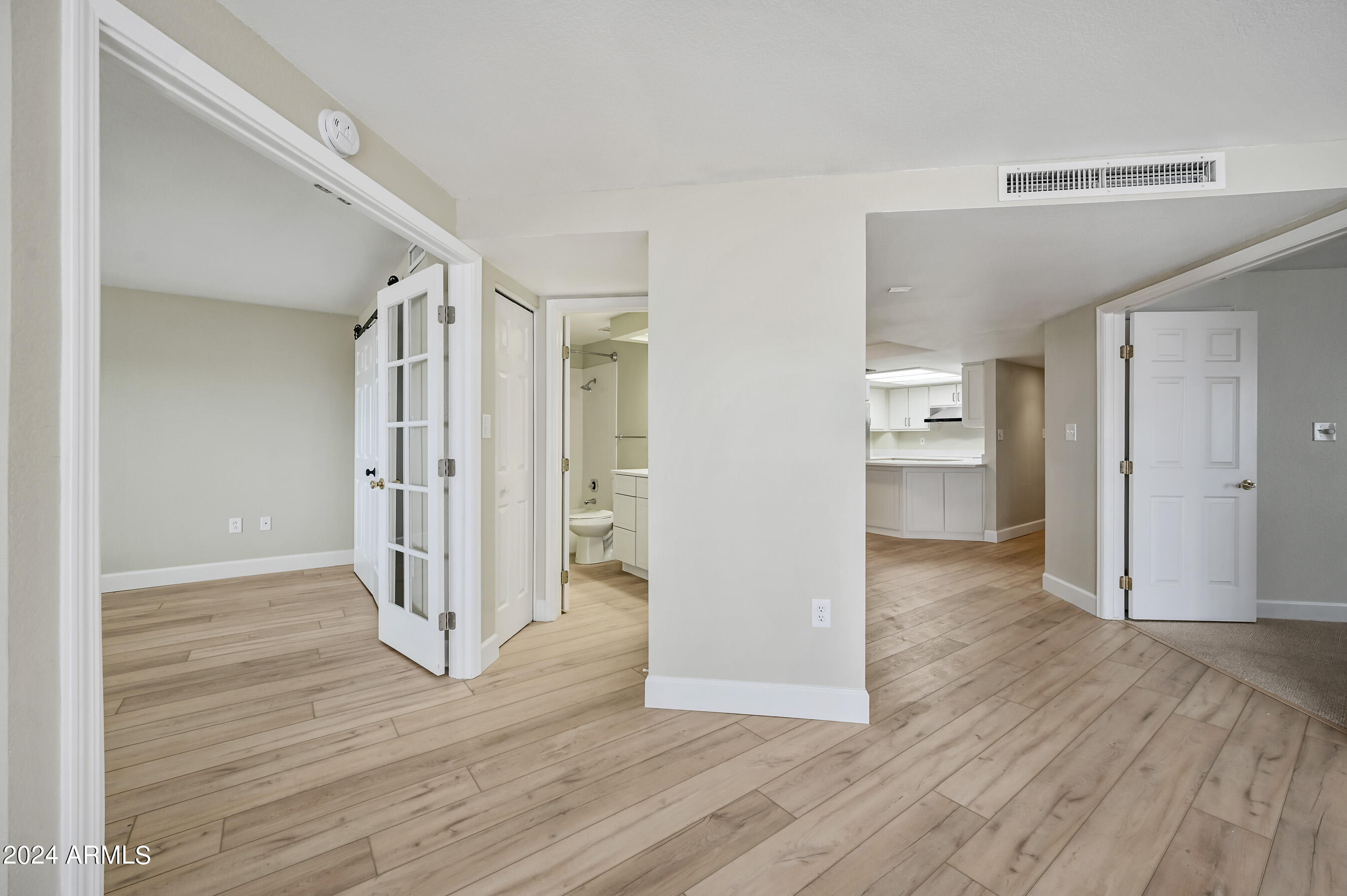17404 North 99th Avenue, Unit 338 Sun City, AZ 85373 - Photo 24 of 27 a view of entryway with wooden floor