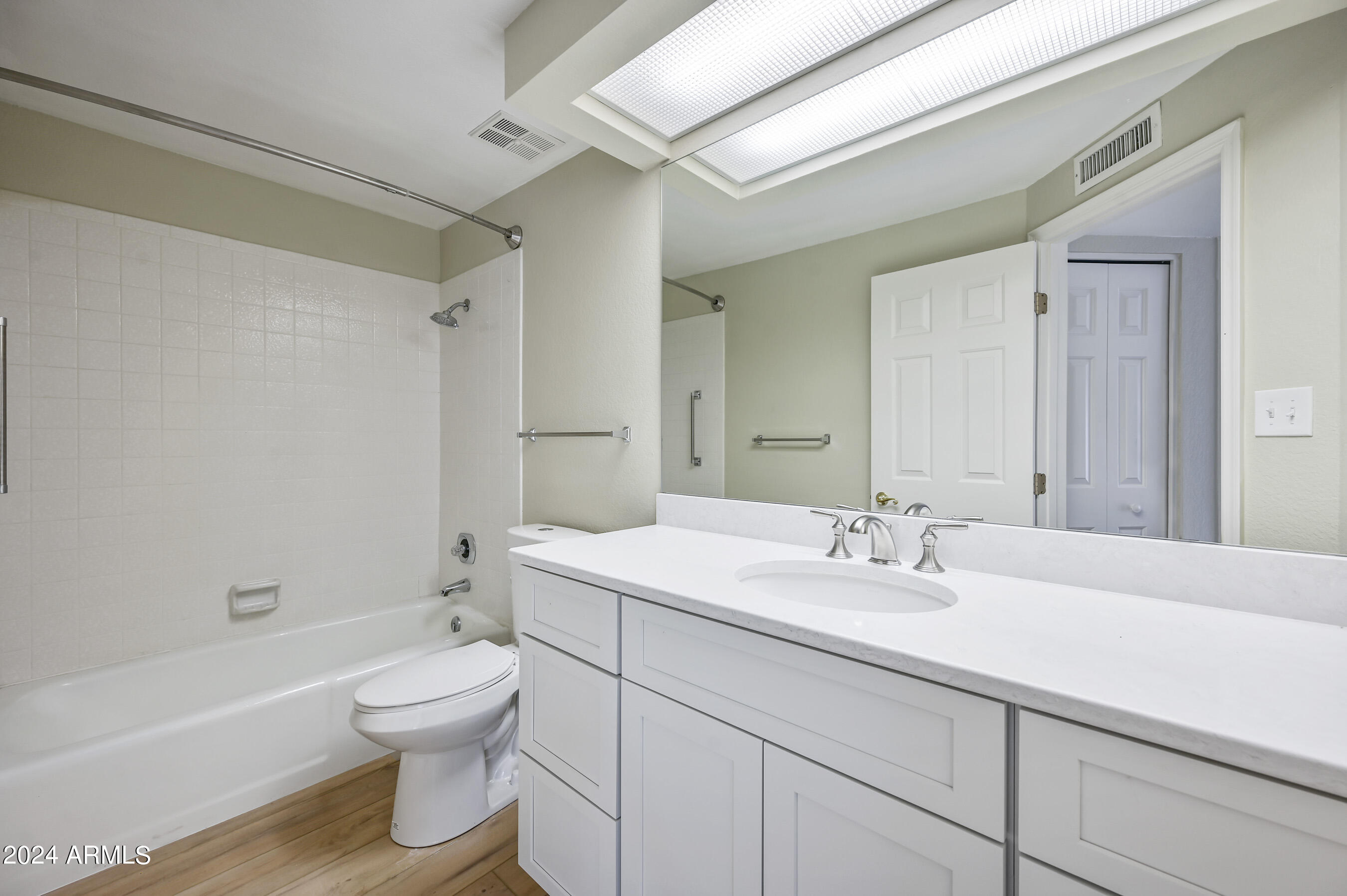 17404 North 99th Avenue, Unit 338 Sun City, AZ 85373 - Photo 26 of 27 a bathroom with a sink a toilet and shower
