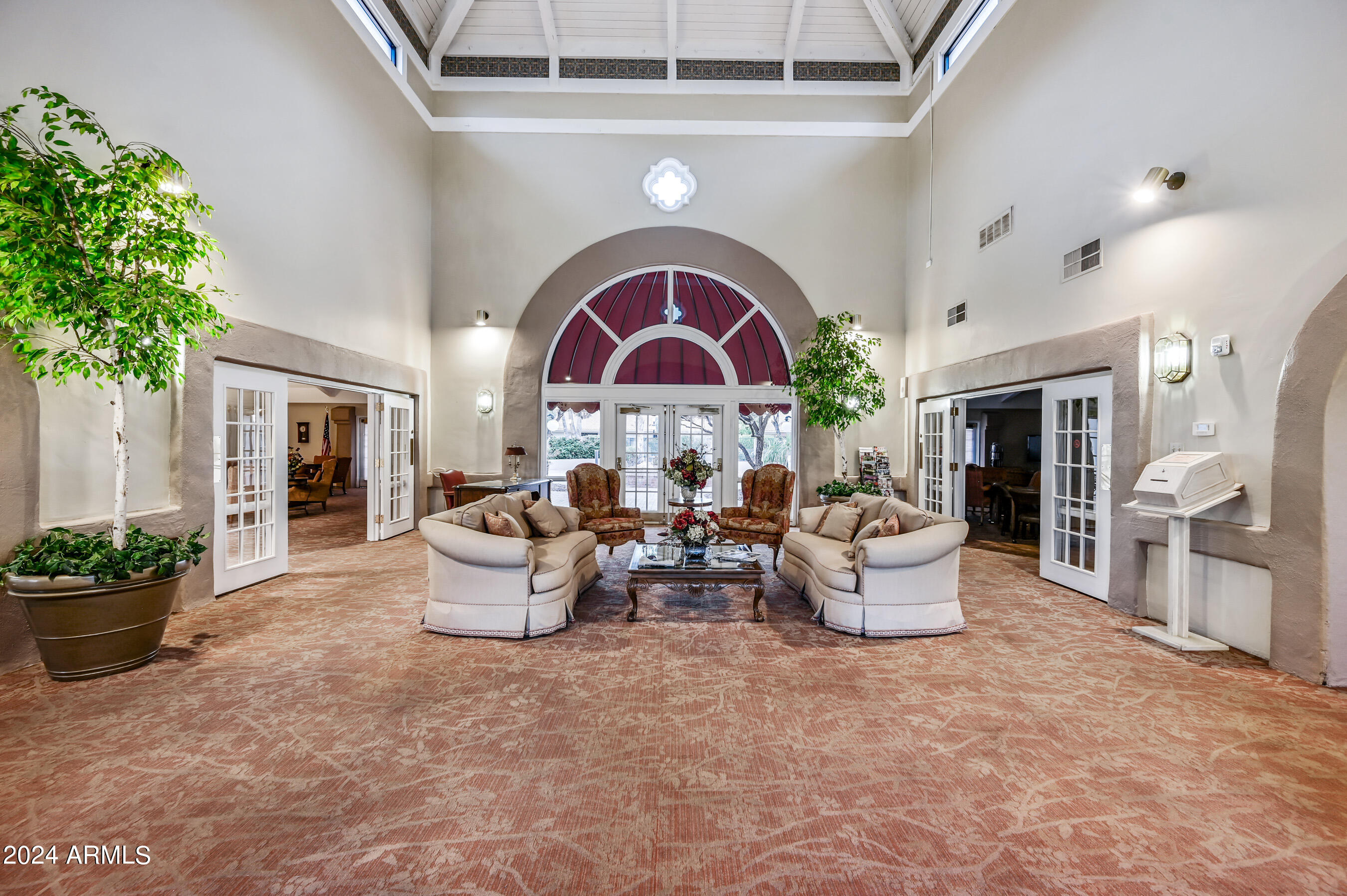17404 North 99th Avenue, Unit 338 Sun City, AZ 85373 - Photo 27 of 27 a living room with furniture and a potted plant