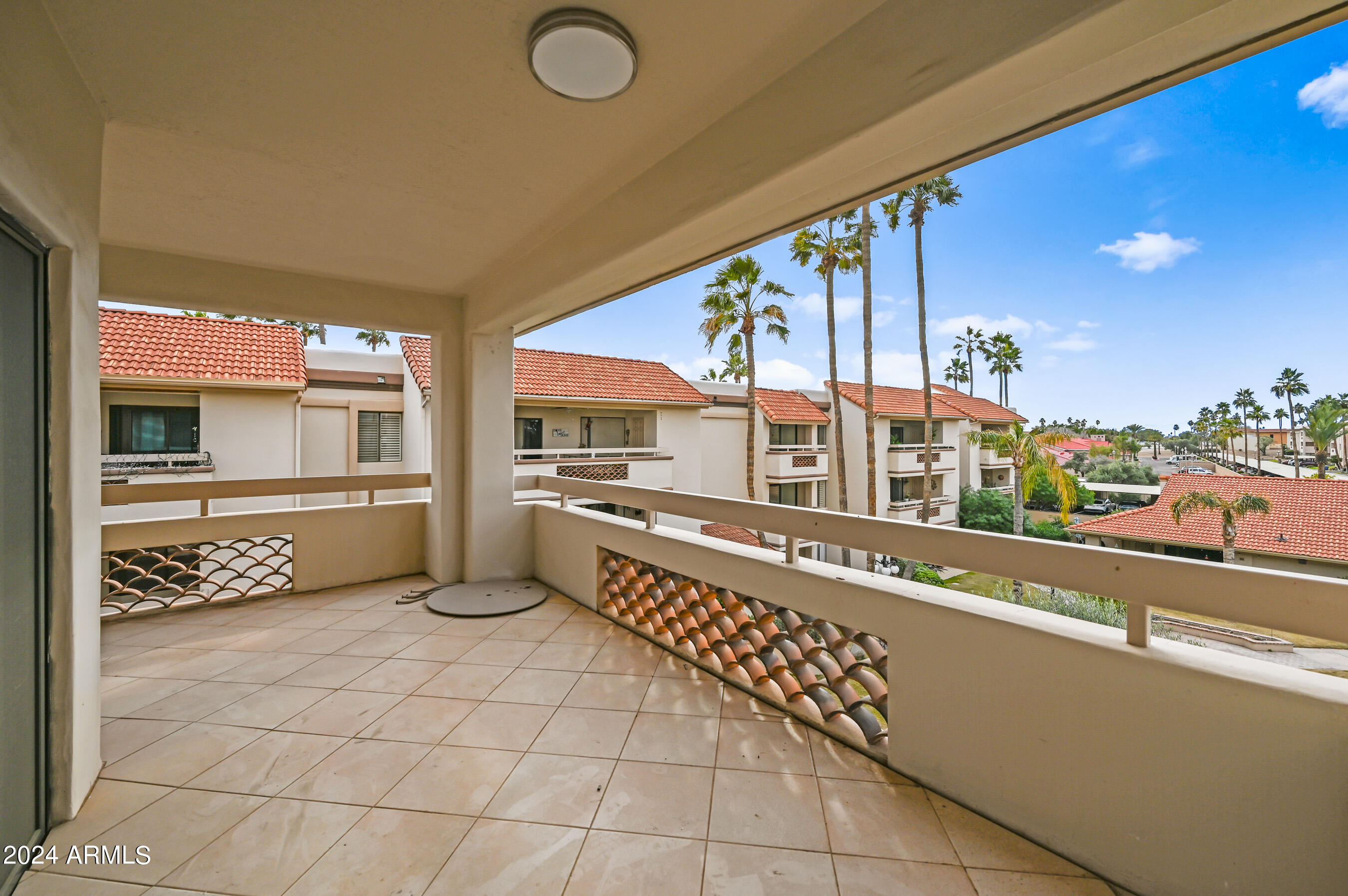 17404 North 99th Avenue, Unit 338 Sun City, AZ 85373 - Photo 7 of 27 a large kitchen with a stove and white cabinets