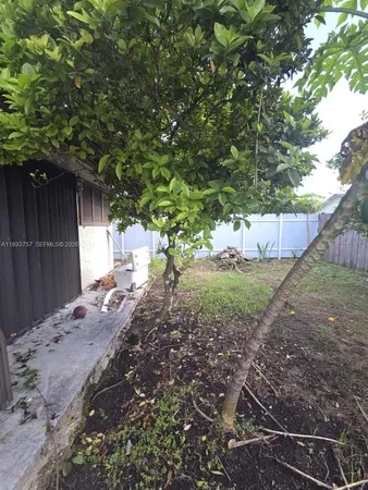 a view of backyard with green space