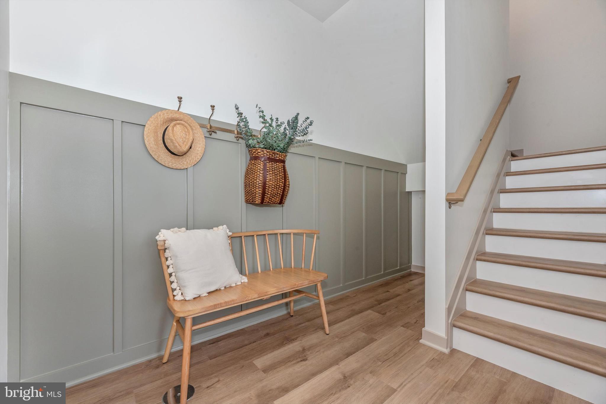 710 Iron Frg Road Frederick, MD 21702 - Photo 5 of 49 a view of a hallway with wooden floor and staircase