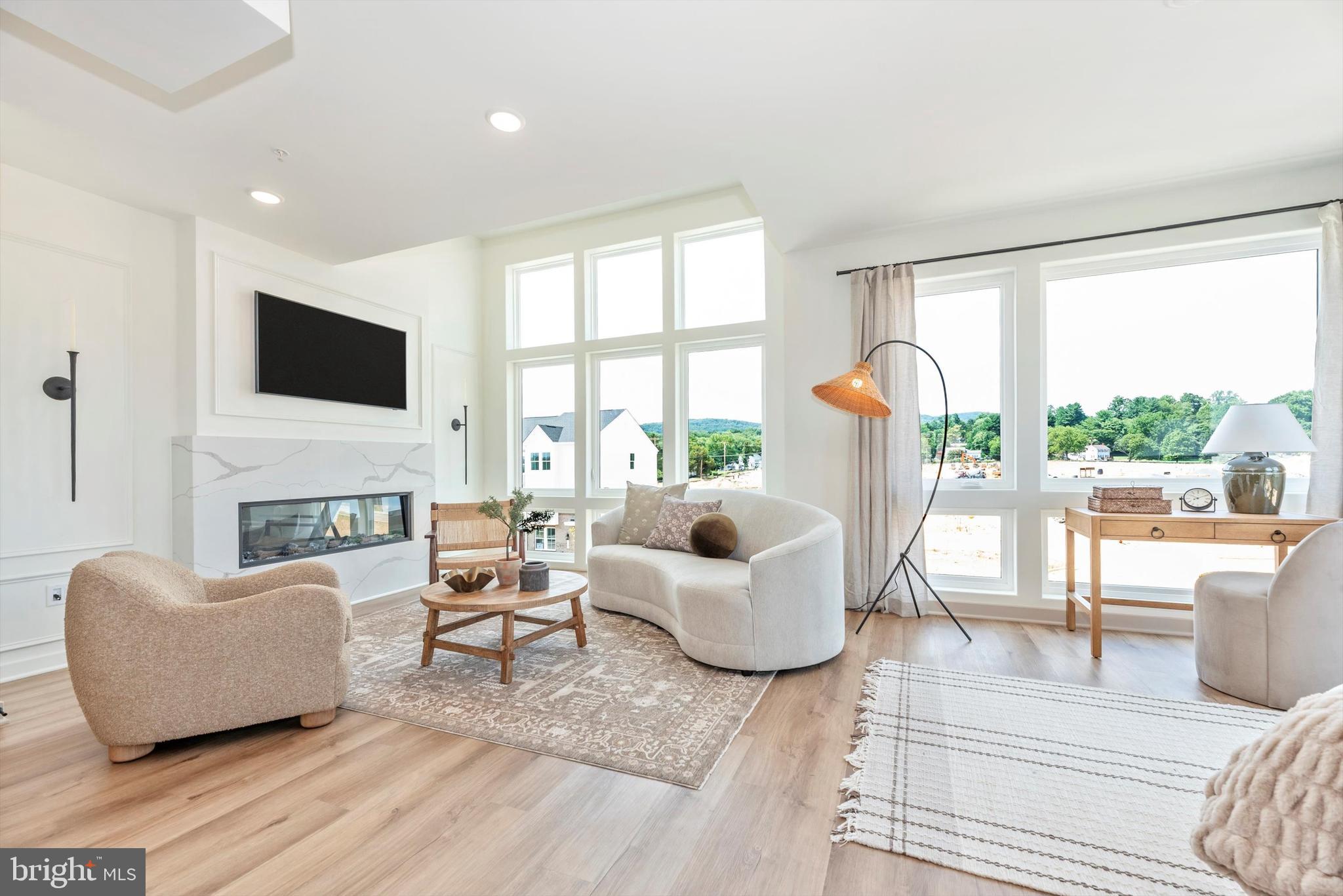710 Iron Frg Road Frederick, MD 21702 - Photo 7 of 49 a living room with fireplace furniture and a flat screen tv