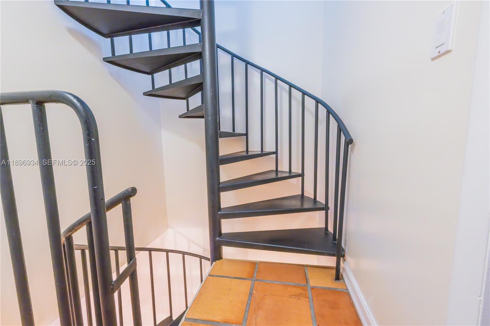 7890 Southwest 86th Street, Unit 11 Miami, FL 33156 - Photo 23 of 31 a view of staircase with railing and a window