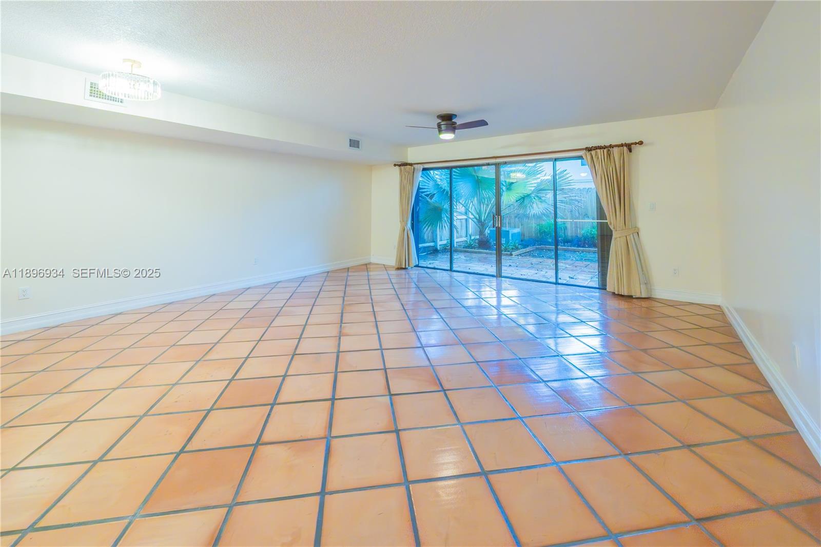 7890 Southwest 86th Street, Unit 11 Miami, FL 33156 - Photo 6 of 31 a view of an empty room and window