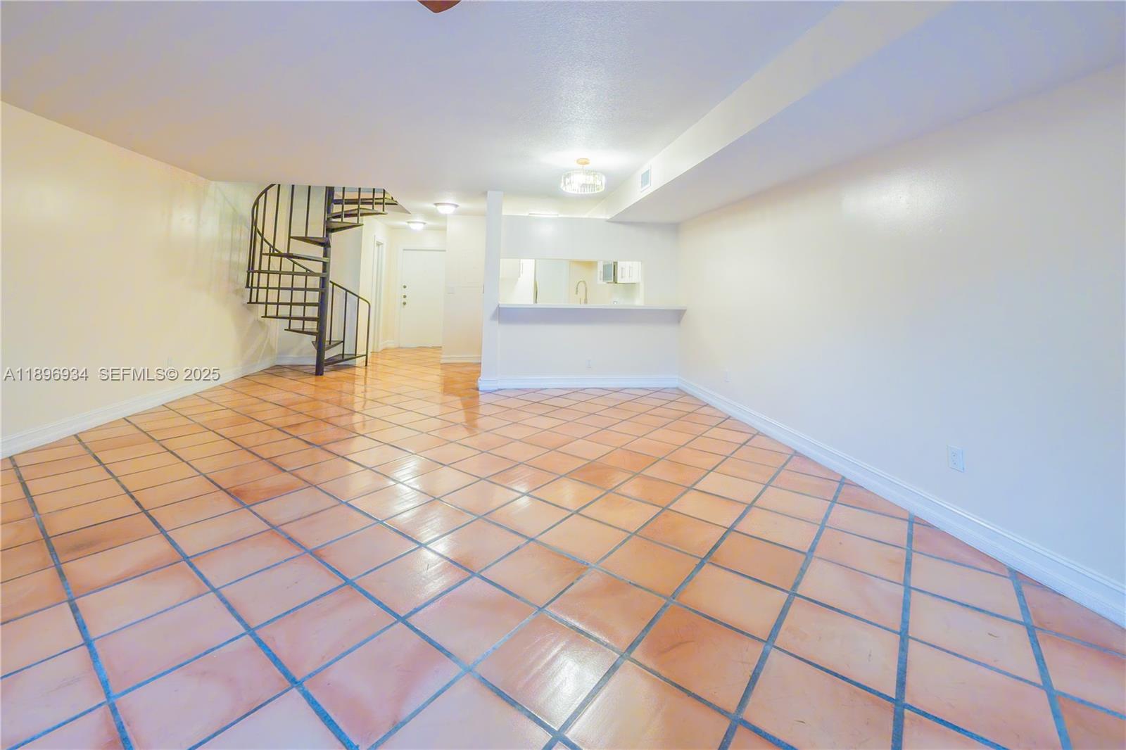 7890 Southwest 86th Street, Unit 11 Miami, FL 33156 - Photo 8 of 31 a view of an empty room and a window