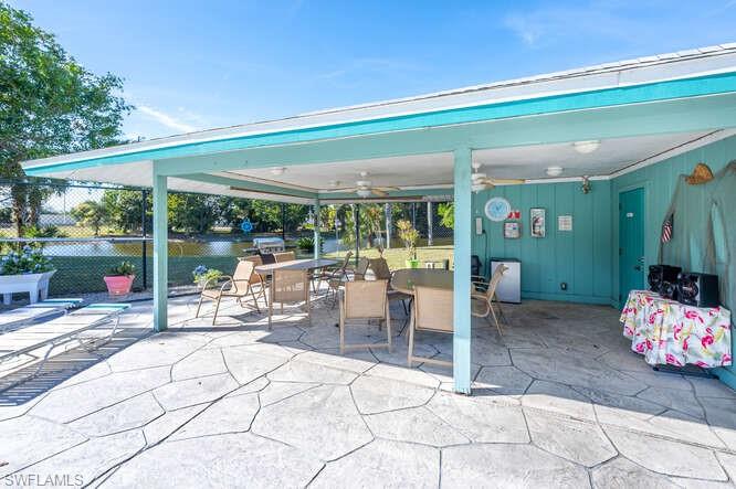 131 Grassy Key Lane, Unit 44 Naples, FL 34114 - Photo 29 of 30 View of patio / terrace featuring ceiling fan and a water view