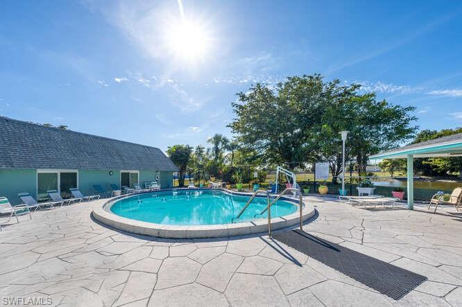 131 Grassy Key Lane, Unit 44 Naples, FL 34114 - Photo 30 of 30 View of pool with a patio