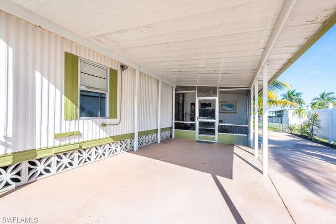 131 Grassy Key Lane, Unit 44 Naples, FL 34114 - Photo 6 of 30 View of patio / terrace featuring a sunroom