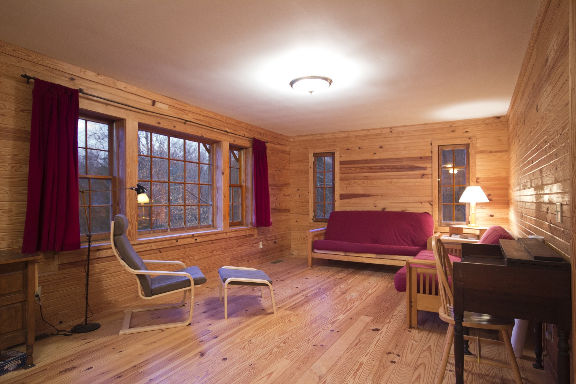 399 Coaling Road Charlotte, TN 37036 - Photo 13 of 32 a living room with furniture a desk and chair with wooden floor