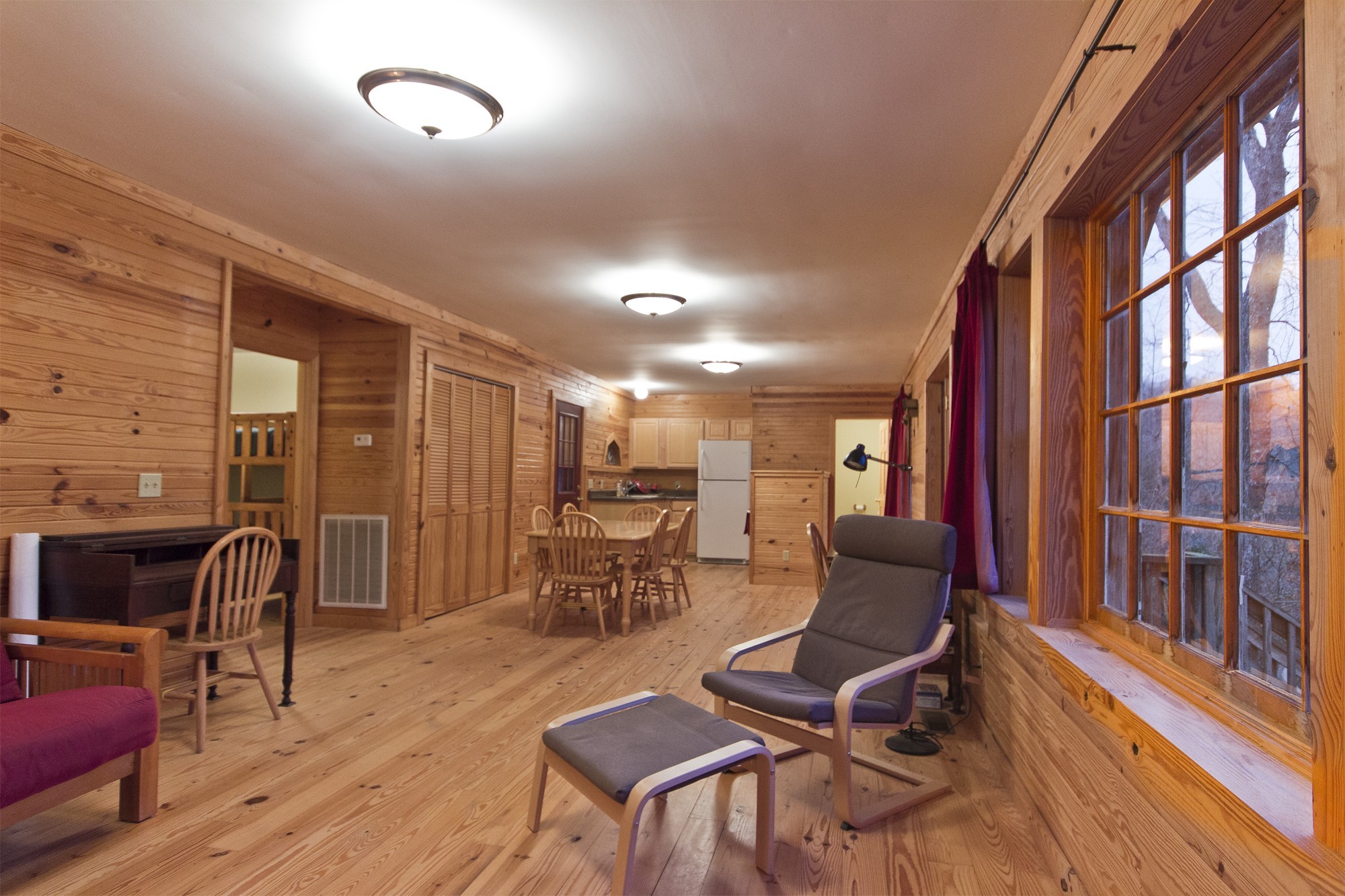 399 Coaling Road Charlotte, TN 37036 - Photo 14 of 32 a living room with furniture a flat screen tv and wooden floor