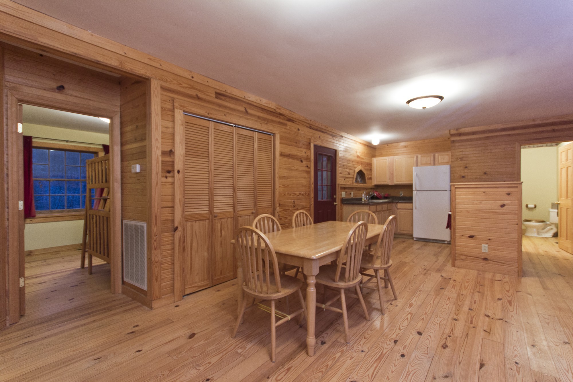 399 Coaling Road Charlotte, TN 37036 - Photo 15 of 32 a view of a dining room with furniture and wooden floor