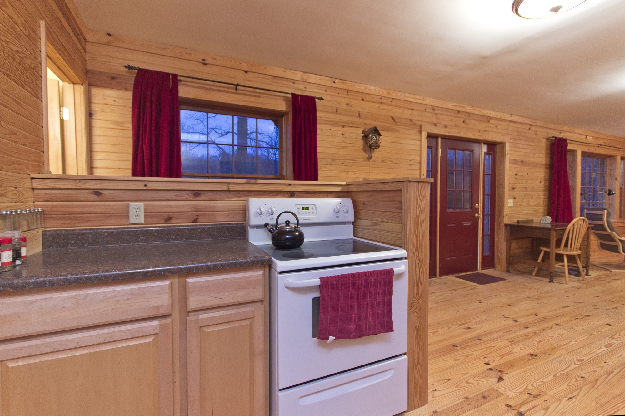 399 Coaling Road Charlotte, TN 37036 - Photo 17 of 32 a kitchen with stainless steel appliances granite countertop a stove a sink and a microwave