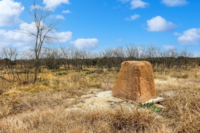 a view of a yard with an ocean