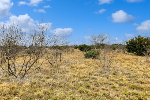 a view of lake with green space