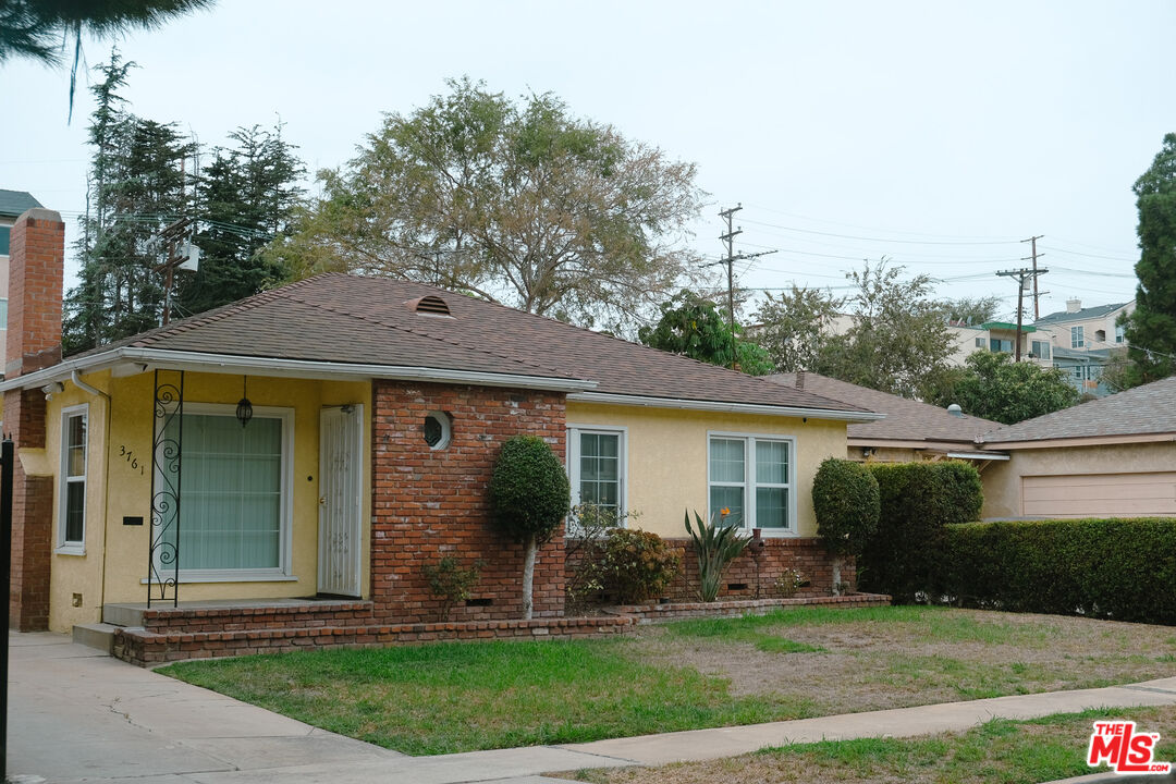 Undisclosed Address Los Angeles, CA 90066 - Photo 2 of 27 a front view of a house with a yard