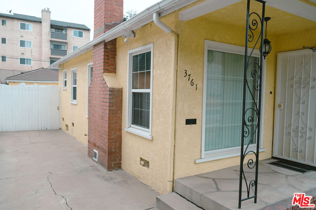 Undisclosed Address Los Angeles, CA 90066 - Photo 21 of 27 a view of a house with a glass door and wooden floor