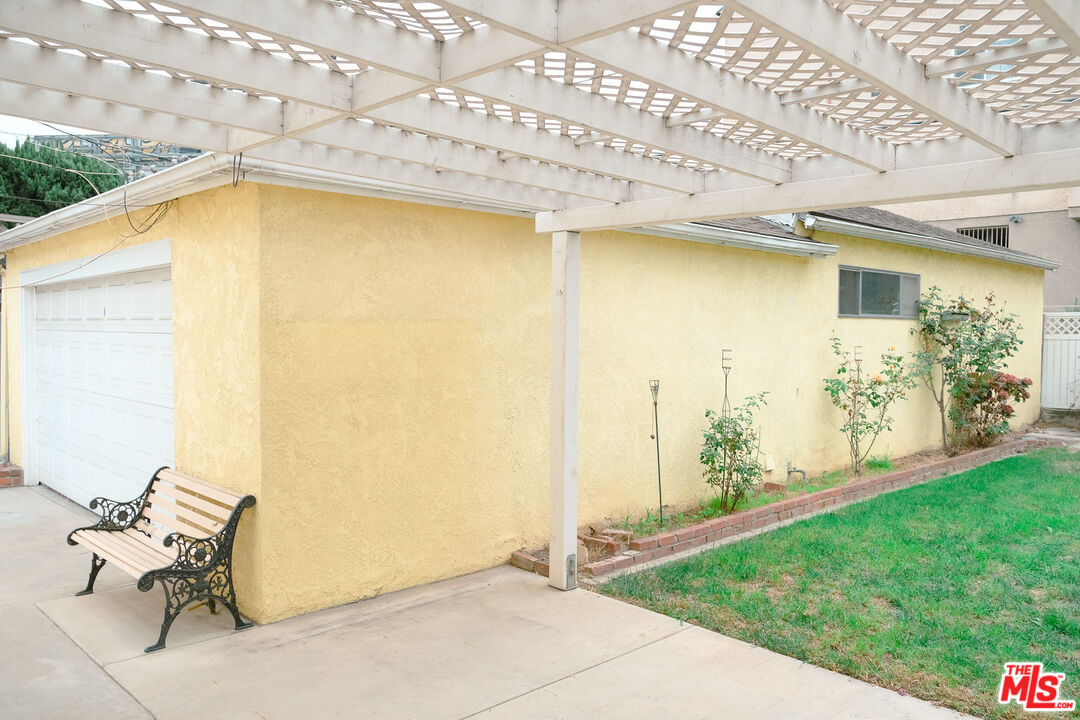 Undisclosed Address Los Angeles, CA 90066 - Photo 26 of 27 a view of a patio with table and chairs and potted plants
