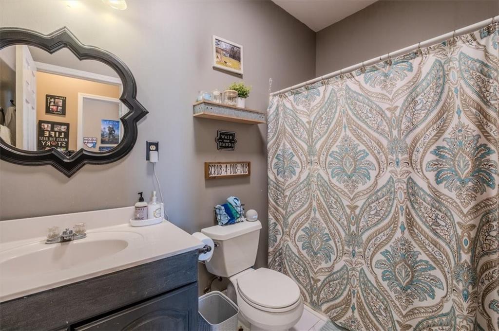 37 Heather Circle Cave Spring, GA 30124 - Photo 15 of 32 a white toilet sitting next to a bathroom sink