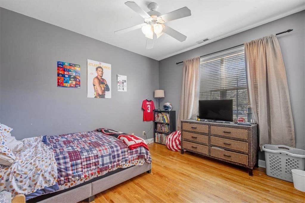 37 Heather Circle Cave Spring, GA 30124 - Photo 16 of 32 a bedroom with furniture and flat screen tv