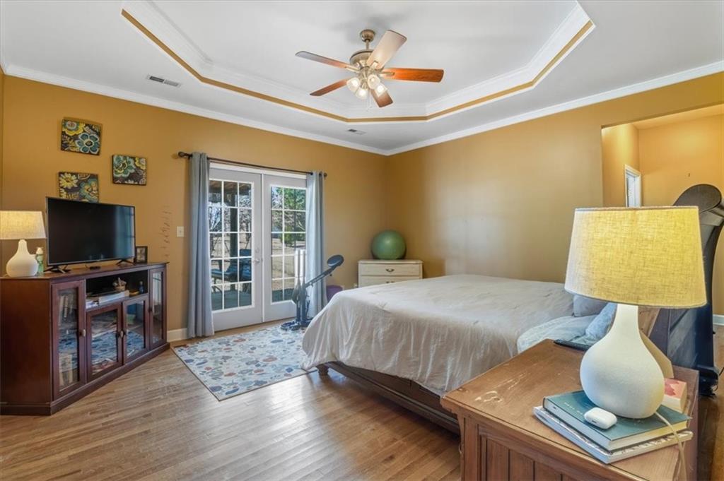 37 Heather Circle Cave Spring, GA 30124 - Photo 17 of 32 a bedroom with a bed and a flat screen tv