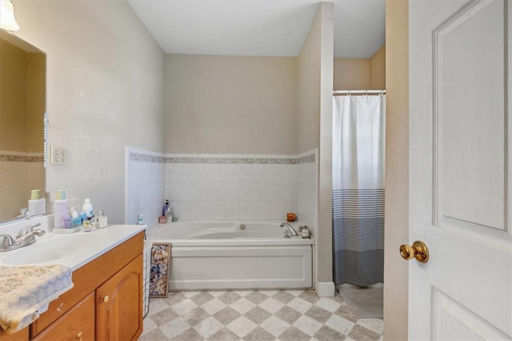 37 Heather Circle Cave Spring, GA 30124 - Photo 18 of 32 a bathroom with a tub sink and toilet