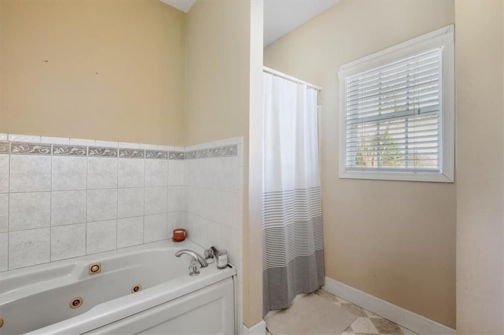 37 Heather Circle Cave Spring, GA 30124 - Photo 21 of 32 a bathroom with a bathtub