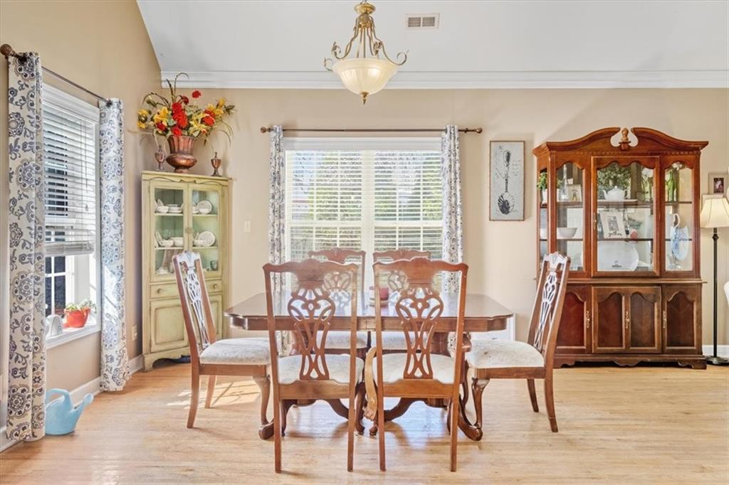 37 Heather Circle Cave Spring, GA 30124 - Photo 7 of 32 a dining room with furniture a chandelier and wooden floor