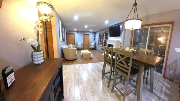 a living room with furniture fireplace and flat screen tv