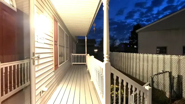 a view of balcony with wooden floor