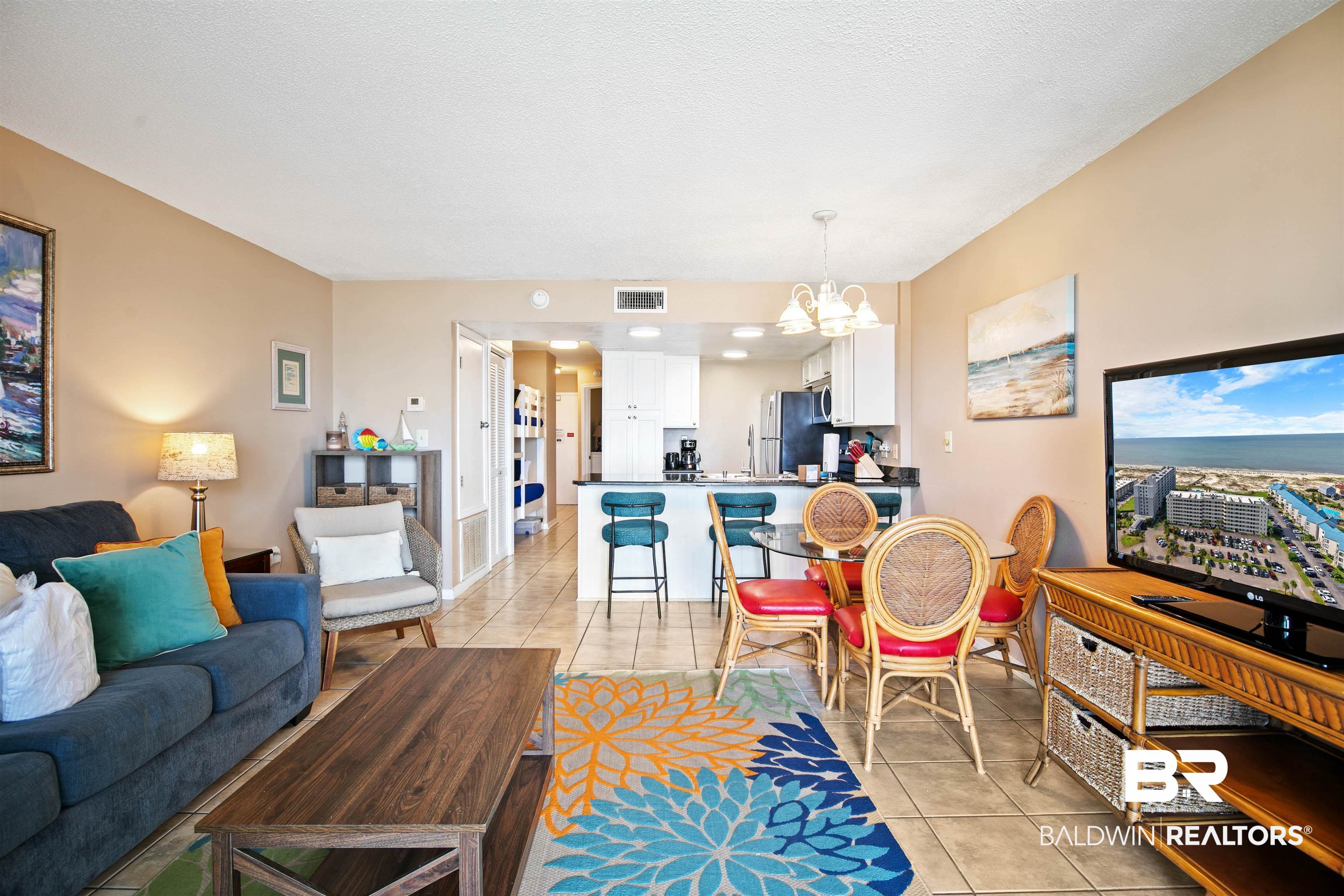 645 Plantation Road, Unit 6606 Gulf Shores, AL 36542 - Photo 6 of 60 Open-concept living area featuring neutral-toned walls and tile flooring