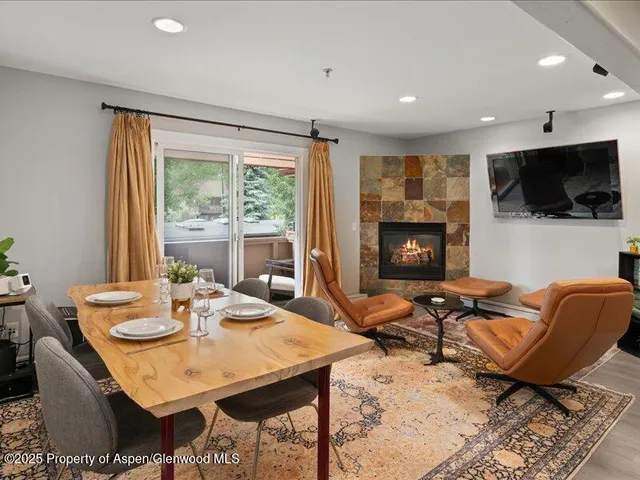 a view of a livingroom with furniture and a flat screen tv