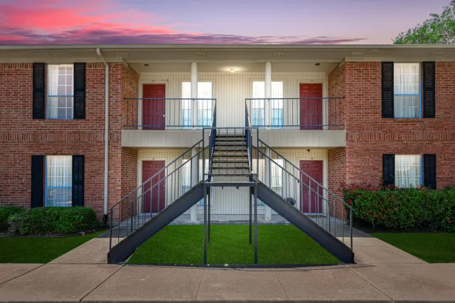 a house view with a garden space