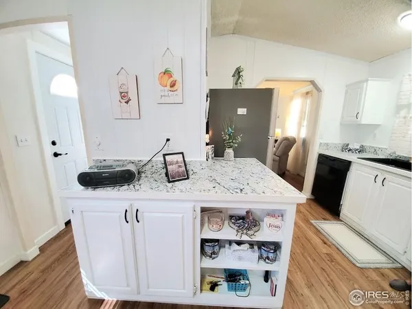 a view of kitchen island with stainless steel appliances kitchen island sink stove and refrigerator