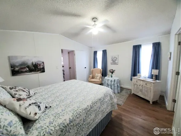 a bedroom with bed and window