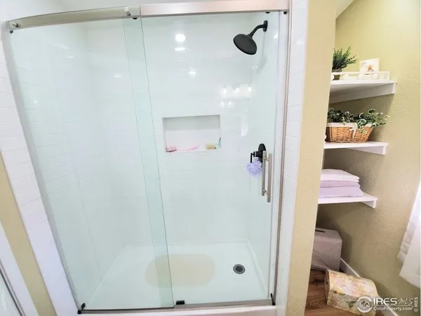 a bathroom with a shower and toilet