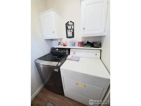 a kitchen with a white cabinets and white appliances