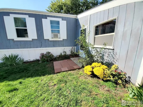 a view of a house with a backyard and garden