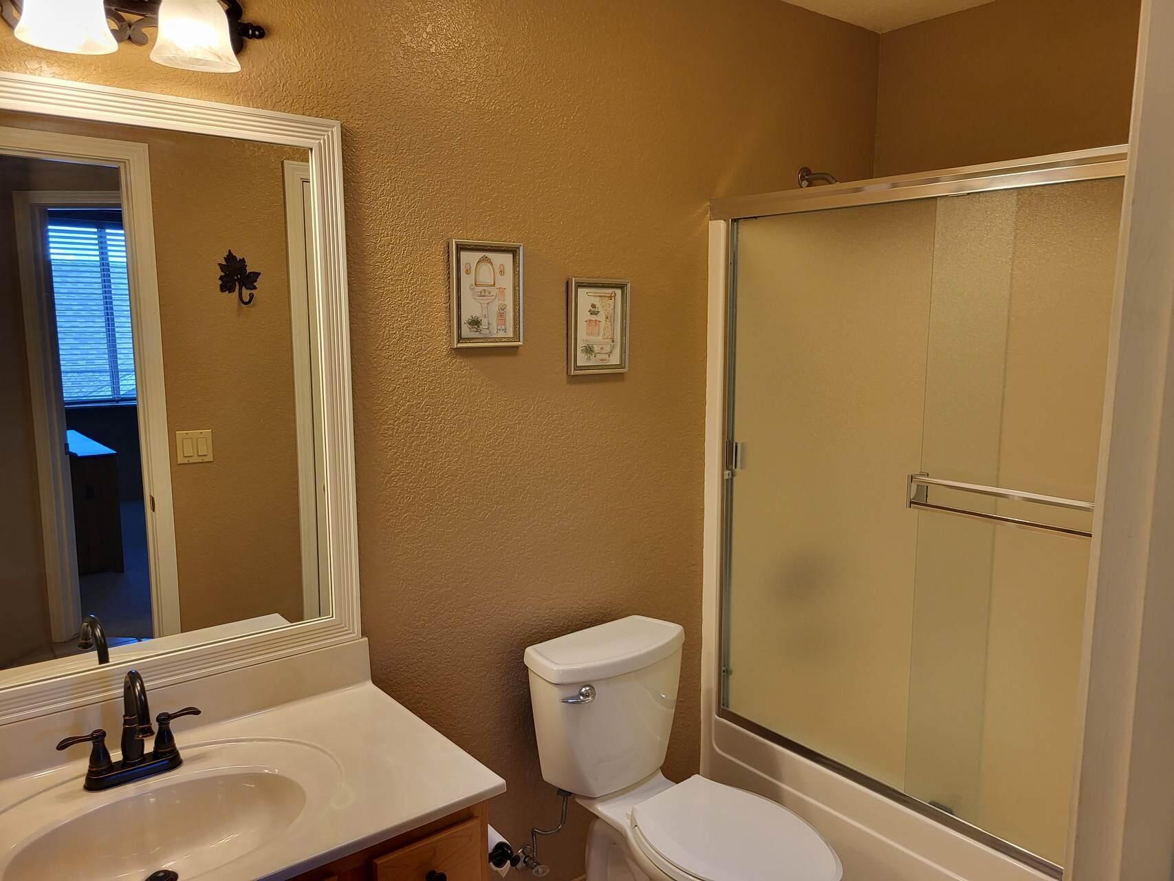 1120 South Sycamore Circle Payson, AZ 85541 - Photo 24 of 44 a bathroom with a sink a toilet and shower