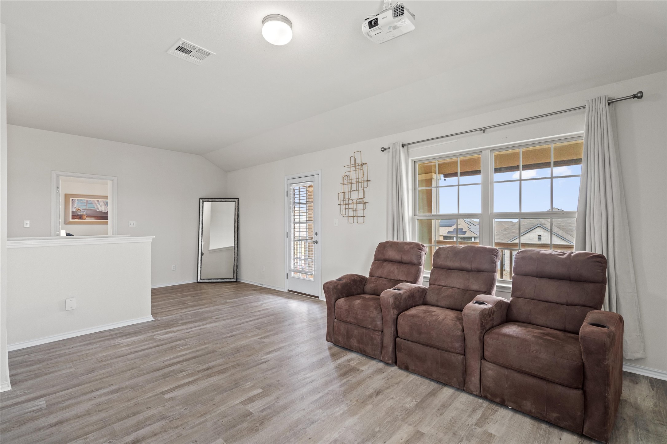 729 Coltrane Drive Pflugerville, TX 78660 - Photo 10 of 20 Upstairs game room with access to the balcony